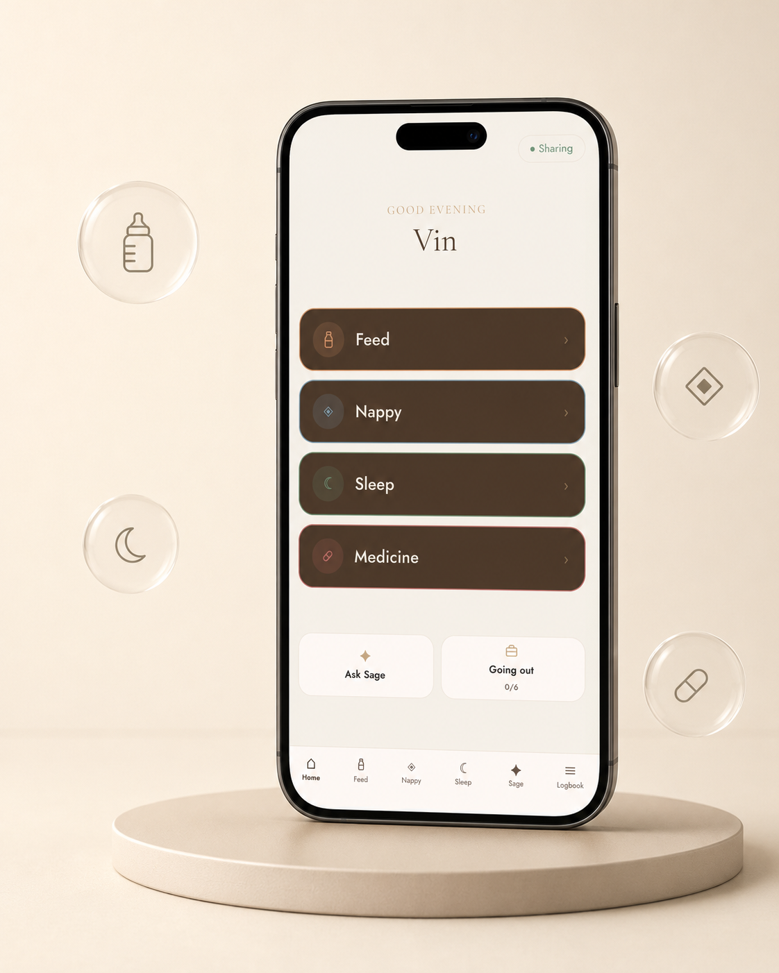 A smartphone centered on a round pedestal, displaying a baby care app screen with tabs for Feed, Nappy, Sleep, and Medicine. The phone is shown against a warm beige background with floating circular icons around it.